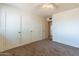 Bedroom with three closets and carpet at 860 Yaqui Dr, Wickenburg, AZ 85390