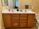 Double sink bathroom with wood cabinets and neutral tones at 1250 S Rialto -- # 47, Mesa, AZ 85209