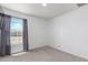 Bedroom with window, dark curtains, and carpet flooring at 14852 S Diablo Rd, Arizona City, AZ 85123