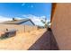 Backyard with gravel, block wall, and a built-in grill at 14852 S Diablo Rd, Arizona City, AZ 85123