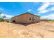 Large backyard with gravel and a view of neighboring houses at 14852 S Diablo Rd, Arizona City, AZ 85123