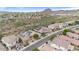 Aerial view of homes and landscape, showing a community setting with desert vegetation and mountain backdrop at 43154 N Outer Banks Dr, Anthem, AZ 85086
