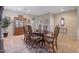 Bright dining room with a wood table and chairs, a china cabinet, and tile flooring at 43154 N Outer Banks Dr, Anthem, AZ 85086