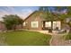 Backyard oasis with artificial turf, patio furniture, and a fire pit at 43154 N Outer Banks Dr, Anthem, AZ 85086