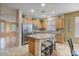 Modern kitchen with granite countertops, stainless steel appliances, and light wood cabinets at 43154 N Outer Banks Dr, Anthem, AZ 85086