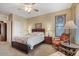 Comfortable bedroom with queen-size bed and sitting chair at 43154 N Outer Banks Dr, Anthem, AZ 85086