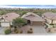 Single story home with solar panels and desert landscaping at 43154 N Outer Banks Dr, Anthem, AZ 85086