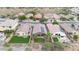 Aerial view of homes with solar panels and lush landscaping at 43154 N Outer Banks Dr, Anthem, AZ 85086