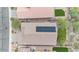 Aerial view of a house featuring solar panels and a green backyard at 43154 N Outer Banks Dr, Anthem, AZ 85086