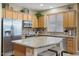 Updated kitchen featuring granite countertops, stainless steel appliances, and ample cabinetry at 43154 N Outer Banks Dr, Anthem, AZ 85086