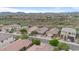 Aerial view of houses in a community, showcasing the neighborhood's layout and mountain views at 43154 N Outer Banks Dr, Anthem, AZ 85086