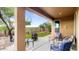 Relaxing covered patio with seating and a fire pit at 43154 N Outer Banks Dr, Anthem, AZ 85086