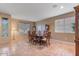 Spacious dining area with a large wooden table, offering ample seating and natural light at 43154 N Outer Banks Dr, Anthem, AZ 85086