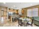 Open kitchen with an island, granite countertops, stainless steel appliances, and light wood cabinets at 43154 N Outer Banks Dr, Anthem, AZ 85086