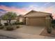 One-story house with a brown garage door and well-maintained landscaping at 43154 N Outer Banks Dr, Anthem, AZ 85086