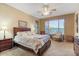 Spacious bedroom with king-size bed and sitting area at 43154 N Outer Banks Dr, Anthem, AZ 85086
