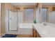 Bathroom with shower, tub, and double vanity at 43154 N Outer Banks Dr, Anthem, AZ 85086