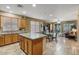 Kitchen with an island, granite countertops, stainless steel appliances, and light wood cabinets at 43154 N Outer Banks Dr, Anthem, AZ 85086