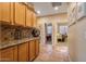 Hallway with tile flooring, built-in cabinets, and view to bedroom at 43154 N Outer Banks Dr, Anthem, AZ 85086