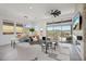 Open living room featuring a fireplace and sliding glass doors at 13190 W Horsetail Trl, Peoria, AZ 85383