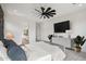 Main bedroom with a view of the bathroom and large TV at 13190 W Horsetail Trl, Peoria, AZ 85383