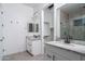 Modern bathroom with double vanity and walk-in shower at 20637 W Rancho Dr, Buckeye, AZ 85396