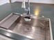 Stainless steel kitchen sink with a stylish gooseneck faucet at 1437 E Wesleyan Dr, Tempe, AZ 85282