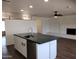 Modern kitchen with island, white cabinets and dark counters at 1437 E Wesleyan Dr, Tempe, AZ 85282