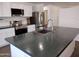 Modern kitchen featuring stainless steel appliances and a large island at 1437 E Wesleyan Dr, Tempe, AZ 85282