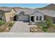 Two-story home with a two-car garage and landscaping at 13190 W Horsetail Trl, Peoria, AZ 85383