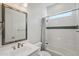 Clean bathroom with white tile, bathtub and shower at 13190 W Horsetail Trl, Peoria, AZ 85383