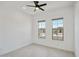 Bright bedroom with ceiling fan and wood-look tile at 13190 W Horsetail Trl, Peoria, AZ 85383