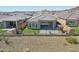 Property showcasing backyard, landscaping, and surrounding neighborhood at 13190 W Horsetail Trl, Peoria, AZ 85383