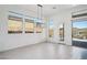 Dining room with large windows, chandelier, and access to patio at 13190 W Horsetail Trl, Peoria, AZ 85383