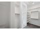 Spacious walk-in closet with custom shelving and hanging rods at 13190 W Horsetail Trl, Peoria, AZ 85383
