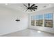 Bright bedroom with large windows offering mountain views and a ceiling fan at 13190 W Horsetail Trl, Peoria, AZ 85383