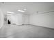 Spacious garage with epoxy floor and extra storage at 13190 W Horsetail Trl, Peoria, AZ 85383