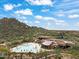 Community pool and clubhouse with desert mountain backdrop at 7755 E Evening Glow Dr, Scottsdale, AZ 85266