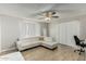 Living room with white sectional sofa and a home office space at 6212 W Cambridge Ave, Phoenix, AZ 85035