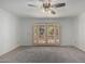 Bright bedroom with patio access and ceiling fan at 1360 E Brown Rd # 25, Mesa, AZ 85203