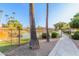 Peaceful lake with surrounding trees and walkway at 1360 E Brown Rd # 25, Mesa, AZ 85203