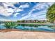 Community waterfront view with a teal fence at 16022 S 11Th Pl, Phoenix, AZ 85048