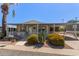 Mobile home with covered porch and mature landscaping at 120 N Val Vista Dr # 70, Mesa, AZ 85213