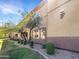 Apartment building exterior showcasing landscaping and building features at 2134 E Broadway Rd # 1019, Tempe, AZ 85282