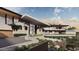Hillside home with modern architecture, featuring stonework and desert landscaping at 7150 N 40Th St # 11, Paradise Valley, AZ 85253