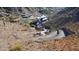 Aerial view of a mountainside construction site with multiple vehicles at 7150 N 40Th St # 11, Paradise Valley, AZ 85253