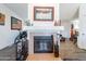 Living room with a gas fireplace and wood-look flooring at 3551 W Ross Ave, Glendale, AZ 85308