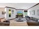 Spacious living room, large TV, comfortable sectional sofa at 8876 S Santa Elizabeth Dr, Goodyear, AZ 85338