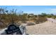 Home entrance with a stone facade and house number at 8876 S Santa Elizabeth Dr, Goodyear, AZ 85338