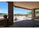 Covered patio with seating and mountain views at 8876 S Santa Elizabeth Dr, Goodyear, AZ 85338